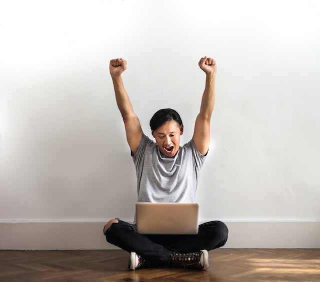 Man celebrating his win from an online casino